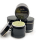Body scrub in a luxury 200g black jar with gold trim.