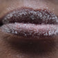 Close-up of lips with a lip scrub coating 