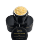 The yellow creamy all natural body butter is in a 200g black luxury jar with gold trim